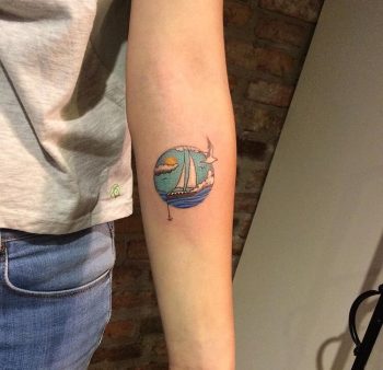 Circular ship in a sea tattoo