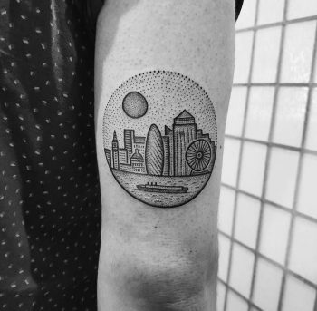 Circular tattoo of a city