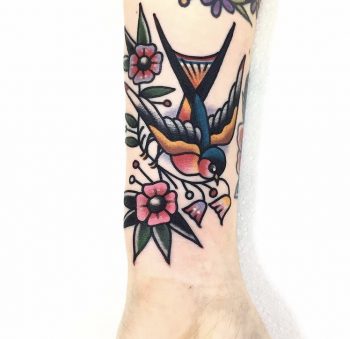 Classic swallow tattoo