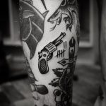 Classy revolver tattoo