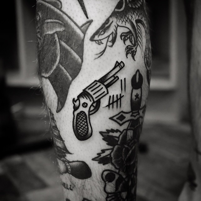 Classy revolver tattoo
