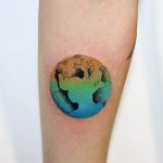 Colorful globe tattoo