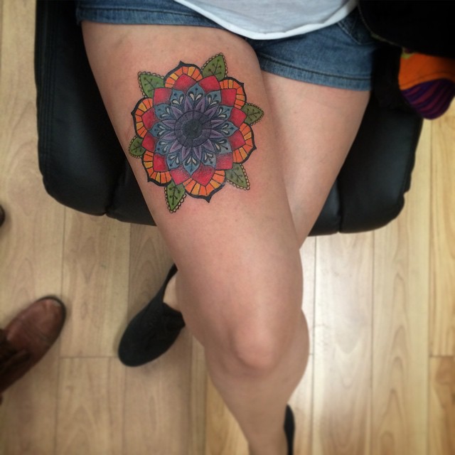 Colorful mandala on the right thigh