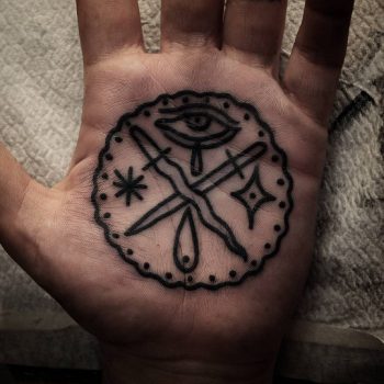 Crossed swords tattoo on palm