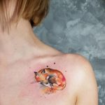 Curled up fox tattoo