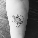 Cute dog in a heart tattoo