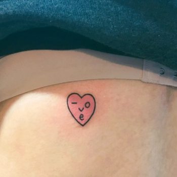 Cute tiny smiley pink heart tattoo