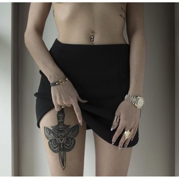 Dagger and a butterfly tattoo