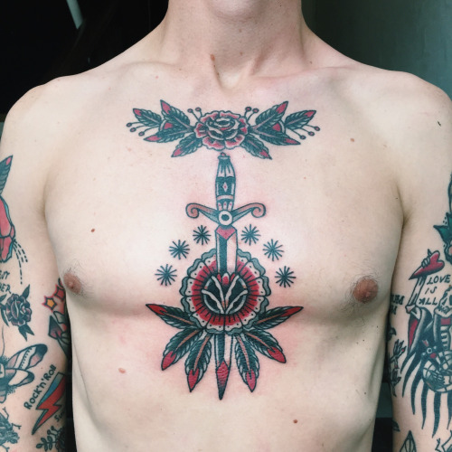 Dagger tattoo on the chest 