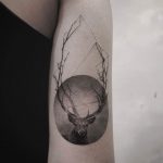 Deer tattoo in a circle
