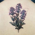 Delicate violet wildflowers tattoo on the back