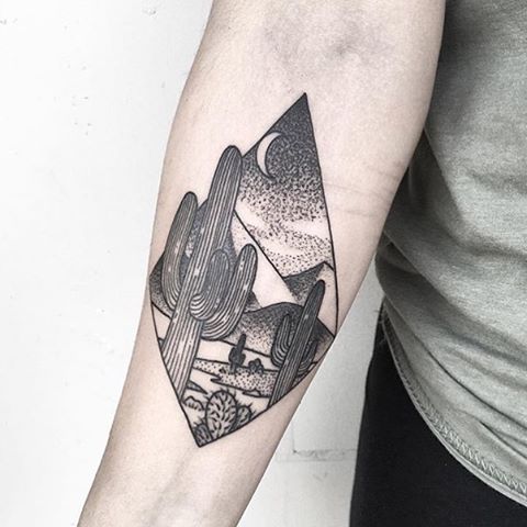 Desert landscape in a rhombus tattoo