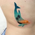 Dolphin tattoo on the rib cage