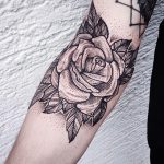Dotwork black rose on arm