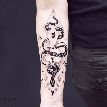 Dotwork black snake tattoo on the left arm
