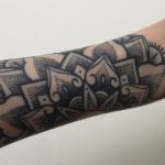 Dotwork mandala tattoo on the left arm