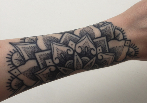 Dotwork mandala tattoo on the left arm