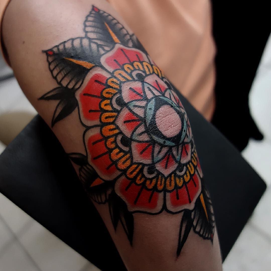 Elbow tattoo of a traditional mandala 