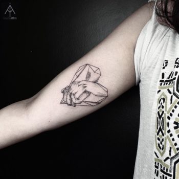 Fingers in a diamond tattoo