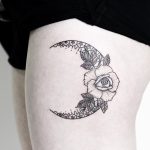 Floral crescent moon tattoo