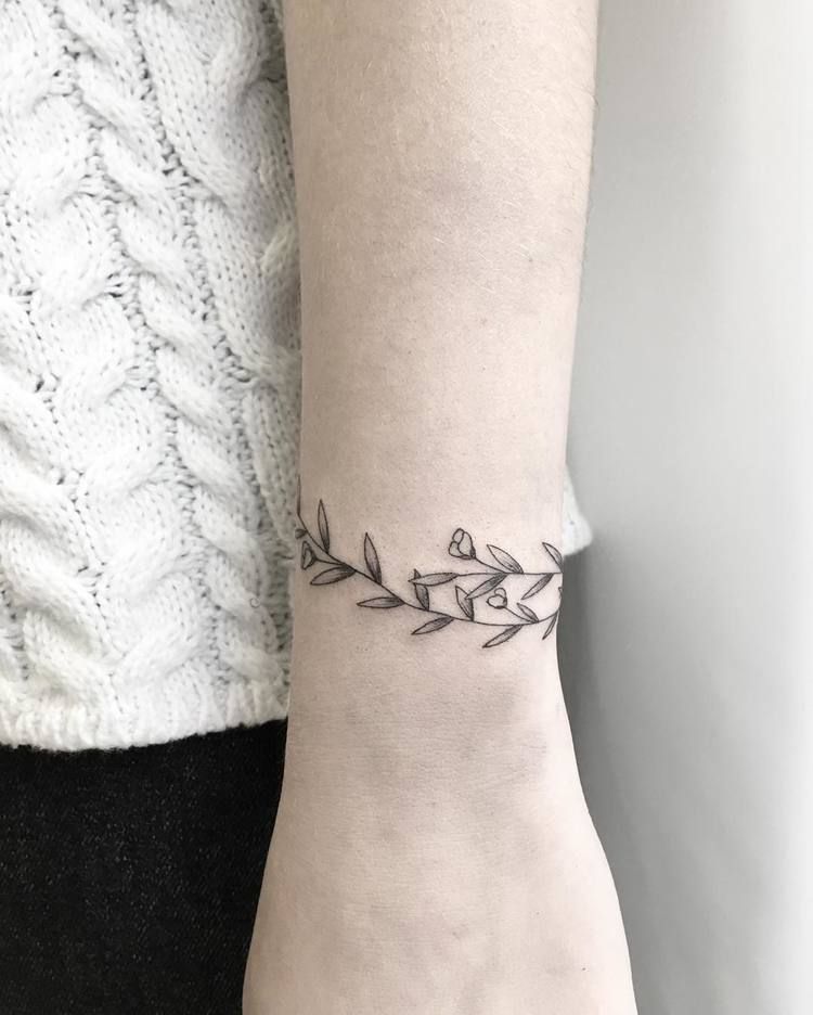 Floral wristband tattoo idea - Tattoogrid.net