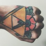Flower and triangle tattoo