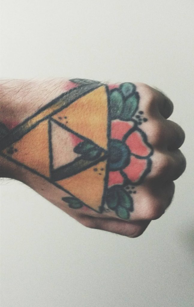 Flower and triangle tattoo