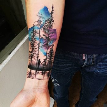 Forest and watercolor sky tattoo