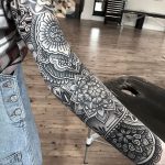 Full black mandala sleeve tattoo