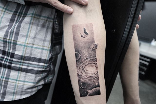 Galaxy landscape and a falling man tattoo