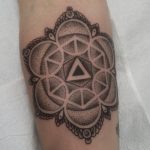Geometric black dotwork style tattoo