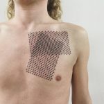 Geometric dot pattern tattoo on the chest