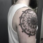 Geometric mandala tattoo on the shoulder