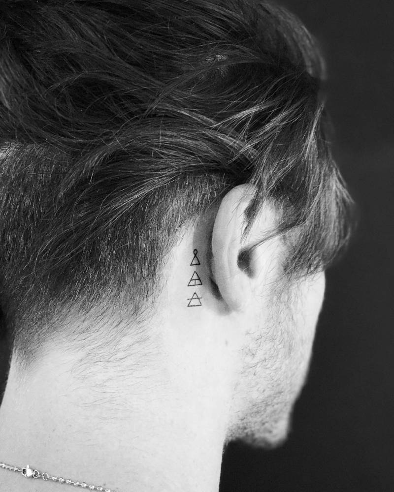 Glyph tattoo behind the ear