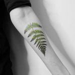 Green fern leaf tattoo