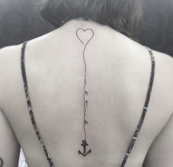 Heart and anchor tattoo on the back