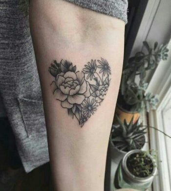 Heart shaped flower tattoo on the arm