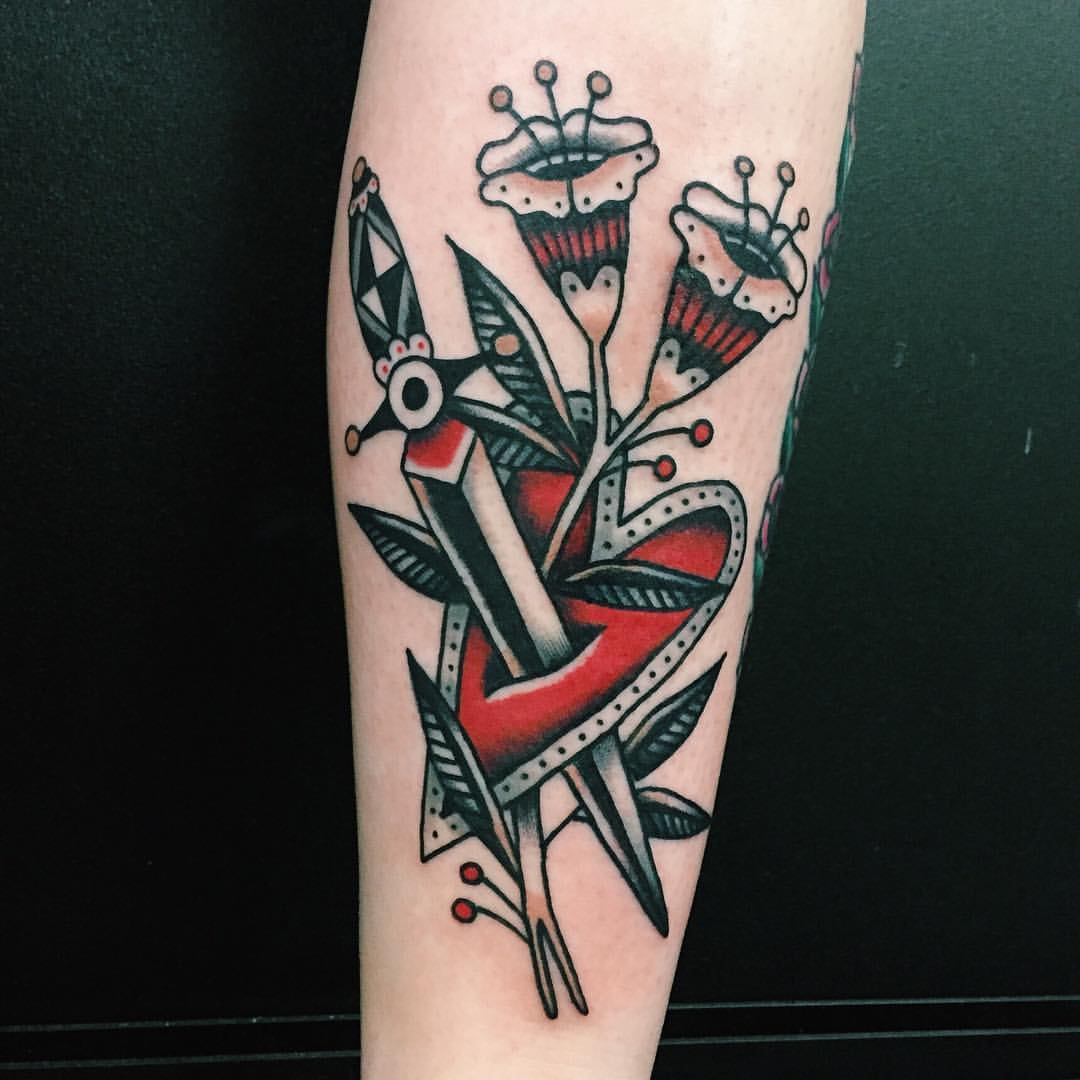 heart-stabbed-with-dagger-and-flowers-tattoo-tattoogrid