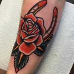 Horseshoe and rose traditional tattoo