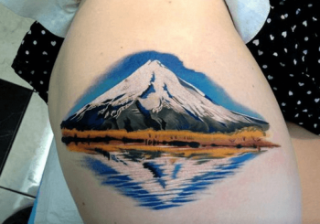 Hyper realistic mountain and reflection tattoo