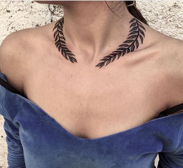 Laurel wreath tattoo around the neck
