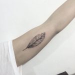 Light black leaf tattoo