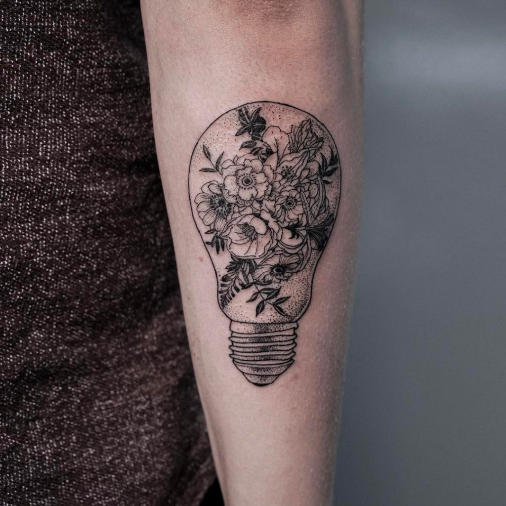 Lightbulb tattoo with flowers inside