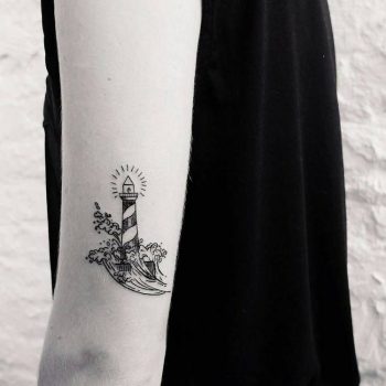 Lighthouse and waves tattoo