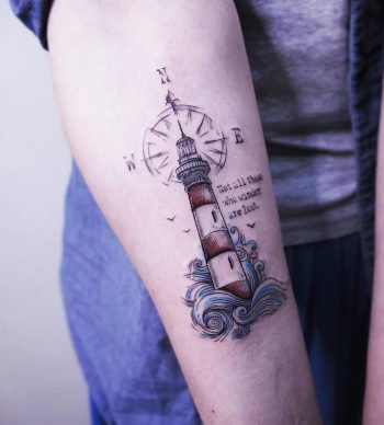Lighthouse with compass tattoo