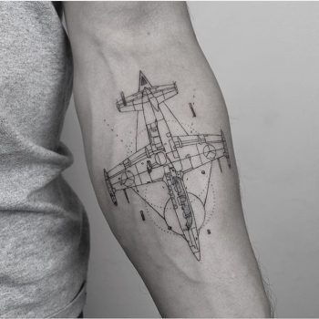 Linear minimal airplane tattoo