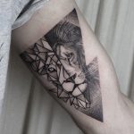 Lion tattoo in a triangle