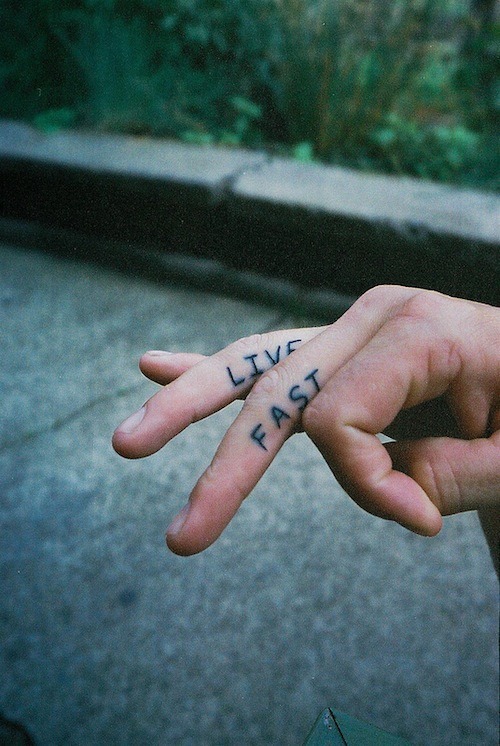 Live fast tattoo on fingers