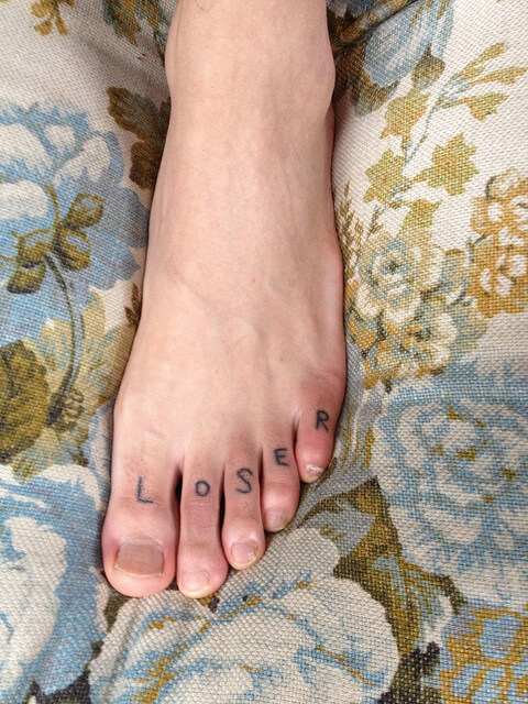 Loser tattoo on the foot