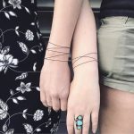 Matching bracelet tattoos